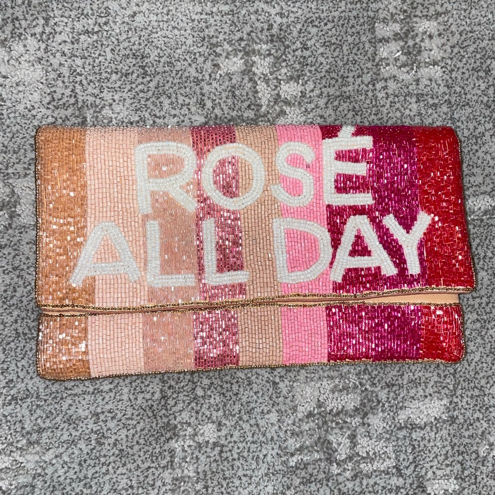 Gorgeous Rose all day fold over beaded clutch.
